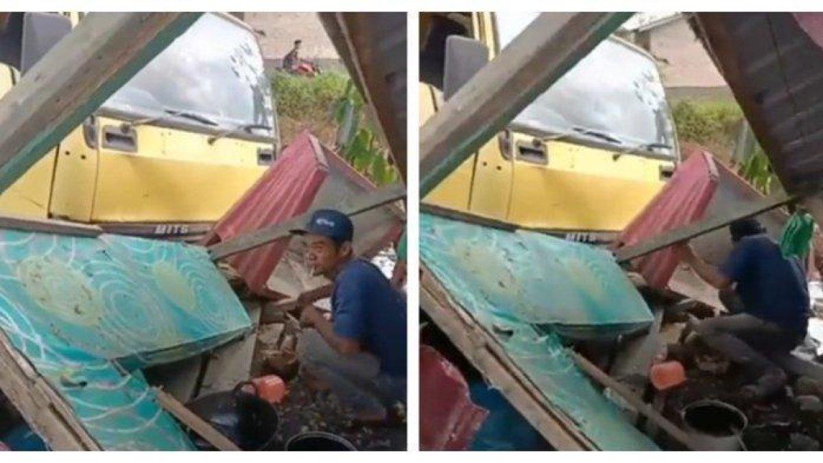 Sopir truk terduduk lemas seusai tabrak sebuah warung