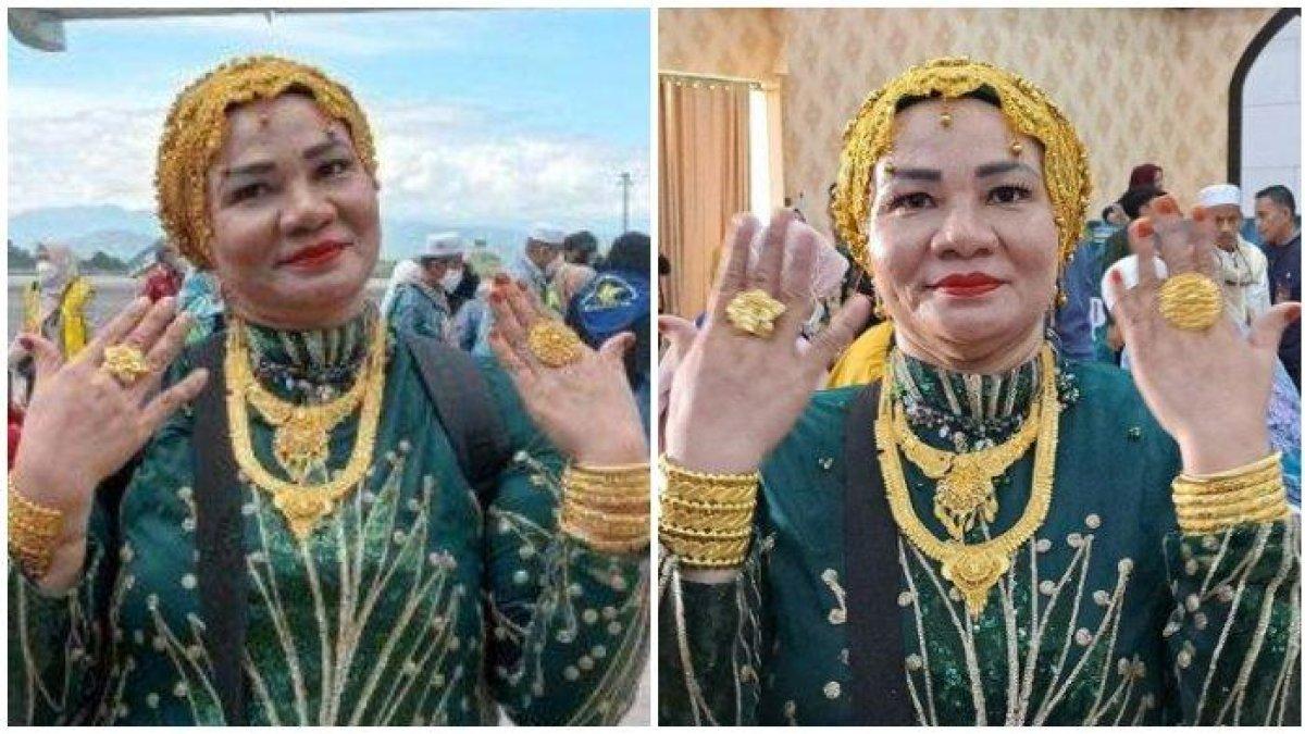Suarnati Daeng Kanang (46), jemaah haji asal Embarkasi Makassar, tampak glamor dengan emas 180 gram di tubuhnya saat tiba di Asrama Haji Sudiang Makassar, Rabu (5/7/2023).