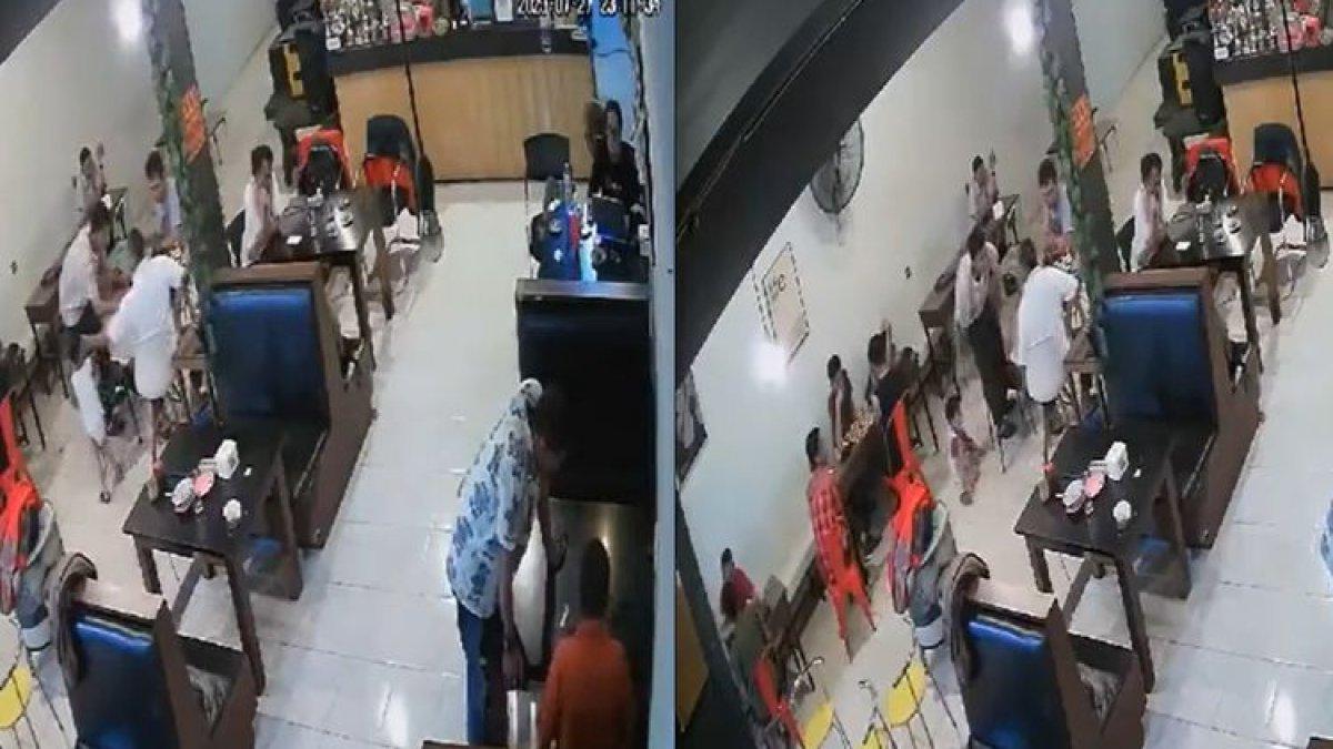 Tangkap layar video rekaman CCTV pria bentak dan pukul anak usia tiga tahun di Makassar.