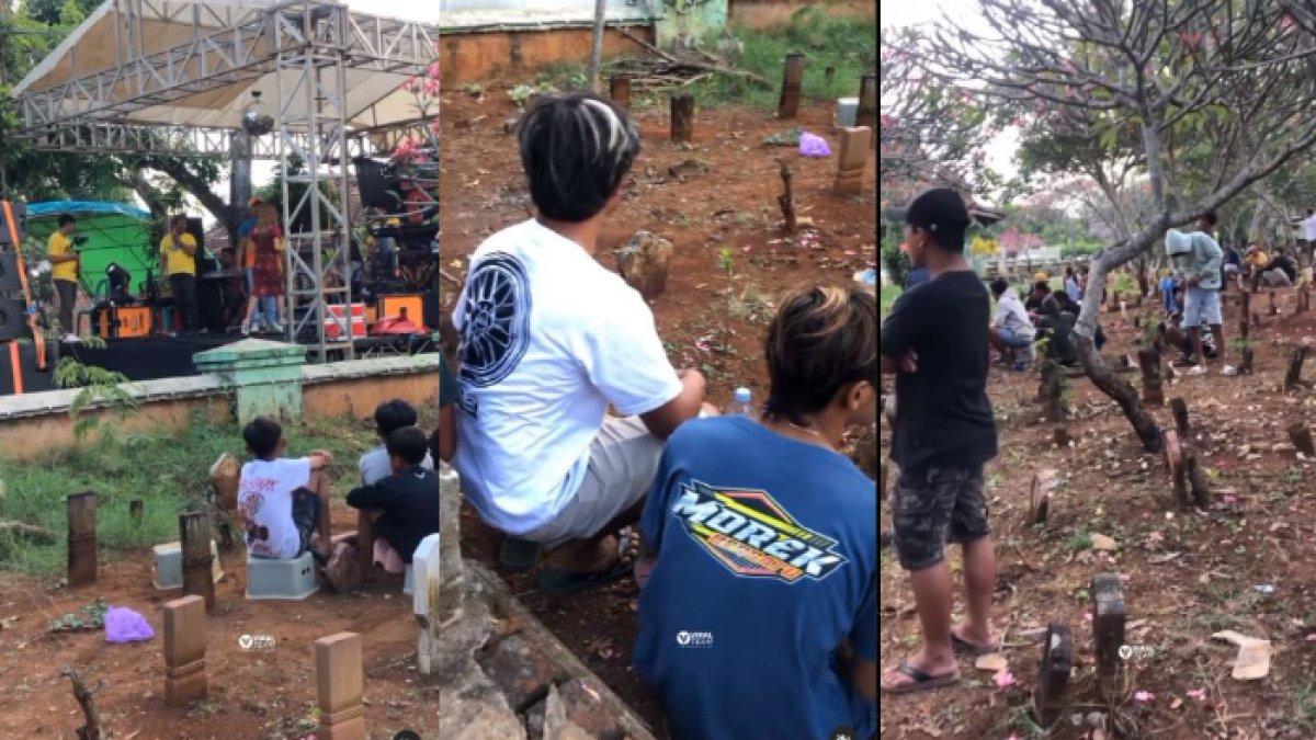 Warga nonton dangdut dari area pemakaman