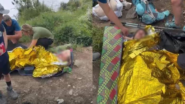 KECELAKAAN - Kolase tangkapan layar saat pendaki asal Swiss mendapat pertolongan usai mengalami kecelakaan di jalur pendakian menuju Danau Segara Anak, dari pintu pendakian Sembalun, di Gunung Rinjani, Lombok, NTB, Rabu (16/7/2025). Pendaki berinisial BE itu berhasil dievakuasi dan diduga mengalami patah tulang dan luka di kepala.