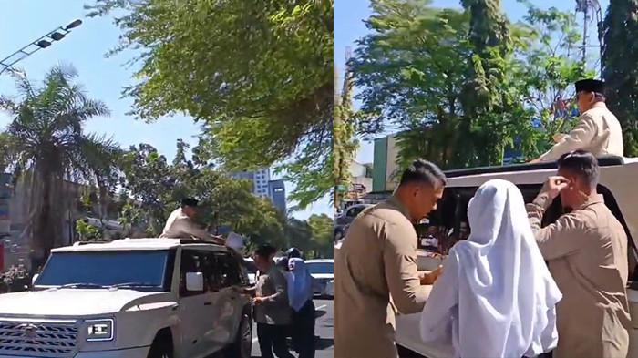 siswi SMPN 3 Solo saat memberikan lukisan ke Prabowo