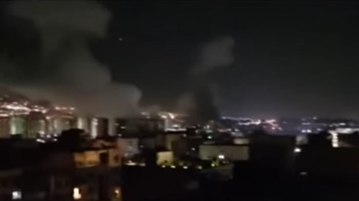 ISRAEL SERANG IRAN - Tangkapan layar dari YouTube Al Jazeera English pada Jumat (13/6/2025) menampilkan situasi saat Israel melancarkan serangan besar yang menargetkan lokasi nuklir dan militer Iran.