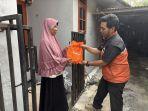 Penyaluran-daging-kurban-ke-pengemudi-mitra-penyedia-layanan-pengiriman-on-demand.jpg