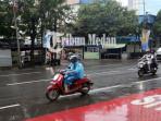 Suasana-hujan-di-Jalan-Guru-Patimpus-Kota-Medan-Rabu-2792024.jpg