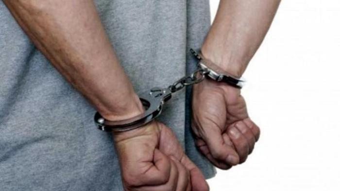 Ilustrasi pelaku kriminal diborgol.